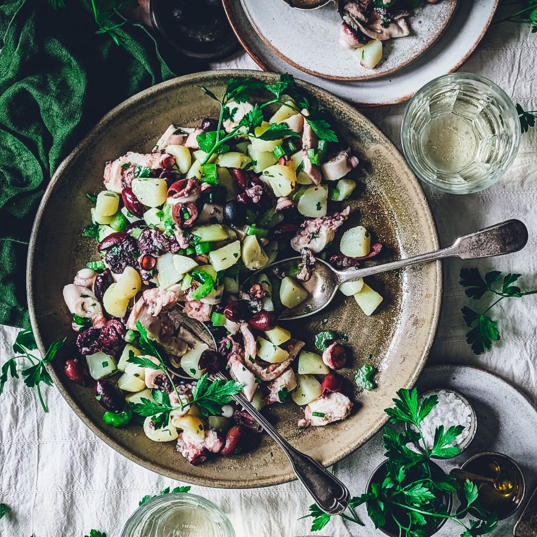 Octopus and potato salad plate with herbs